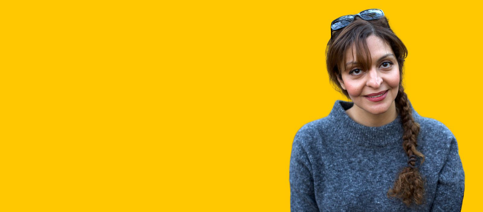 Nutritionist and author Atoosa Sepehr photographed against a yellow background.